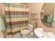 Cozy bathroom featuring neutral color scheme, vanity sink, and shower with patterned curtain at 2241 Waterview Dr. # 315, North Myrtle Beach, SC 29582