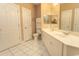 Bright bathroom with white tiled floors, white cabinets, double vanity, and coordinated fixtures at 2241 Waterview Dr. # 315, North Myrtle Beach, SC 29582