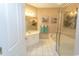 Bathroom features a double sink vanity, a bathtub with shower and boat-themed artwork at 2241 Waterview Dr. # 315, North Myrtle Beach, SC 29582