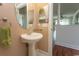 Stylish half bathroom featuring pedestal sink, modern fixtures, and neutral color palette at 2241 Waterview Dr. # 315, North Myrtle Beach, SC 29582