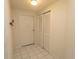 Bright hallway with tile flooring, closet, and white door at 2241 Waterview Dr. # 315, North Myrtle Beach, SC 29582