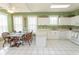 Open kitchen and dining area with white cabinets, white appliances, and bright natural light at 2241 Waterview Dr. # 315, North Myrtle Beach, SC 29582