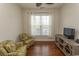 Comfortable living room with two armchairs, hardwood floors, console table and natural light from the windows at 2241 Waterview Dr. # 315, North Myrtle Beach, SC 29582