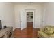 Cozy living room features hardwood floors, comfortable seating, an open doorway and neutral paint scheme at 2241 Waterview Dr. # 315, North Myrtle Beach, SC 29582