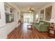 Cozy living room featuring hardwood floors, built in shelving, and a comfortable green sofa at 2241 Waterview Dr. # 315, North Myrtle Beach, SC 29582