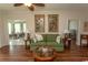 Open living room featuring hardwood floors, ceiling fan, and access to dining area at 2241 Waterview Dr. # 315, North Myrtle Beach, SC 29582