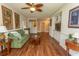 Spacious living room featuring hardwood floors, built in shelving, and a comfortable sofa at 2241 Waterview Dr. # 315, North Myrtle Beach, SC 29582