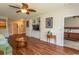 Open living room featuring hardwood floors, built in shelving, and doorway to the main bedroom at 2241 Waterview Dr. # 315, North Myrtle Beach, SC 29582