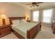 Spacious main bedroom with trey ceilings, ceiling fan, carpet, two windows, dresser and night stands at 2241 Waterview Dr. # 315, North Myrtle Beach, SC 29582