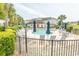 Community pool area surrounded by lounge chairs, palm trees, and lush landscaping at 2241 Waterview Dr. # 315, North Myrtle Beach, SC 29582
