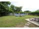 Lush backyard featuring a fire pit, lounge chairs, and a privacy fence, ideal for outdoor activities at 233 Oak Lea Dr., Conway, SC 29526