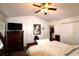 Well-lit bedroom featuring a ceiling fan, vaulted ceilings, and ample closet space for storage at 233 Oak Lea Dr., Conway, SC 29526