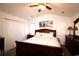 Comfortable bedroom showcasing a full-size bed, beach-themed artwork, and plenty of closet space at 233 Oak Lea Dr., Conway, SC 29526