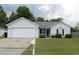 Charming single-story home with a two-car garage, well-maintained lawn, and classic curb appeal at 233 Oak Lea Dr., Conway, SC 29526