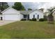 Charming single story home with well-manicured lawn and an attached two car garage at 233 Oak Lea Dr., Conway, SC 29526