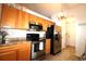 Well-lit kitchen featuring stainless steel appliances, light oak cabinets, and neutral countertops at 233 Oak Lea Dr., Conway, SC 29526