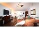 Spacious living room with hardwood floors, a ceiling fan, and a cozy fireplace for relaxing evenings at 233 Oak Lea Dr., Conway, SC 29526