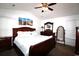 Cozy main bedroom with vaulted ceilings, beautiful furniture, carpet flooring, and beach-themed artwork at 233 Oak Lea Dr., Conway, SC 29526