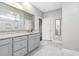 Modern bathroom features a spacious vanity, large mirror, and a walk-in shower at 2492 Goldfinch Dr., Myrtle Beach, SC 29577