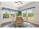 Cozy breakfast nook featuring a round table, four chairs, and scenic views through multiple windows at 2492 Goldfinch Dr., Myrtle Beach, SC 29577