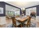 Open-concept dining area connected to the living room, featuring a large table and natural light at 2492 Goldfinch Dr., Myrtle Beach, SC 29577