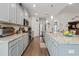 Bright kitchen with stainless steel appliances, granite counters, wooden floors, and modern grey cabinets at 2492 Goldfinch Dr., Myrtle Beach, SC 29577