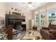 Comfortable home office featuring a large desk, ample natural light, and a cozy recliner at 2492 Goldfinch Dr., Myrtle Beach, SC 29577