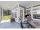Relaxing screened-in patio with outdoor seating, views of backyard, and access to interior spaces at 2492 Goldfinch Dr., Myrtle Beach, SC 29577