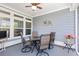 Inviting screened patio with outdoor furniture, decorative accents, and a peaceful backyard view at 2492 Goldfinch Dr., Myrtle Beach, SC 29577