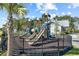 Community playground with slides and climbing structure with the pool house in the background at 2492 Goldfinch Dr., Myrtle Beach, SC 29577
