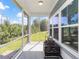 Covered porch offering backyard views, screened windows, and an outdoor grill at 2492 Goldfinch Dr., Myrtle Beach, SC 29577