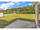 Backyard featuring a white fence, lake views, and lush green space at 2546 Whetstone Ln., Myrtle Beach, SC 29579
