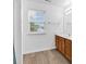 Bright bathroom featuring hardwood flooring, a window, and a wood vanity at 2546 Whetstone Ln., Myrtle Beach, SC 29579