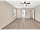 Bright bedroom featuring hardwood flooring, a ceiling fan, and natural light from the window at 2546 Whetstone Ln., Myrtle Beach, SC 29579