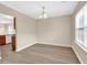 Well-lit dining room featuring stylish chandelier and wood-look flooring at 2546 Whetstone Ln., Myrtle Beach, SC 29579