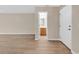 Spacious foyer with new laminate flooring leading to an open floorplan and half bath at 2546 Whetstone Ln., Myrtle Beach, SC 29579