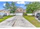 Inviting two-story home with a spacious driveway, attached garage, and well-maintained front yard at 2546 Whetstone Ln., Myrtle Beach, SC 29579