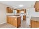 Bright kitchen featuring wood cabinetry, white appliances, and ample counter space at 2546 Whetstone Ln., Myrtle Beach, SC 29579