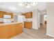 Spacious kitchen featuring wood cabinets, and white appliances with a view to the backyard at 2546 Whetstone Ln., Myrtle Beach, SC 29579