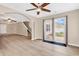 Spacious living room with laminate flooring, natural light, and an open layout to the backyard at 2546 Whetstone Ln., Myrtle Beach, SC 29579