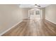 Open-concept living room featuring new laminate flooring, neutral paint, and abundant natural light at 2546 Whetstone Ln., Myrtle Beach, SC 29579