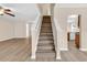 A neutral staircase with wood-look treads and white risers and trim is shown in the home at 2546 Whetstone Ln., Myrtle Beach, SC 29579