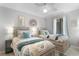 Charming bedroom with twin beds, coastal decor, and plenty of natural light at 307 74Th Ave. N # 3C, Myrtle Beach, SC 29572