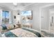 Bright bedroom featuring twin beds, a mounted TV, and beach-themed accents for a relaxing atmosphere at 307 74Th Ave. N # 3C, Myrtle Beach, SC 29572