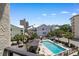 View from balcony of the community's inviting pool area, homes, and surrounding landscape at 307 74Th Ave. N # 3C, Myrtle Beach, SC 29572