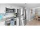 Kitchen area featuring stainless steel appliances and subway tile back splash, open to the dining area at 307 74Th Ave. N # 3C, Myrtle Beach, SC 29572