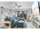 Comfortable living room featuring a sectional sofa, coastal decor, and a sliding glass door at 307 74Th Ave. N # 3C, Myrtle Beach, SC 29572