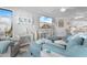 Bright living room with coastal-themed decor, comfortable seating, and a view into the kitchen at 307 74Th Ave. N # 3C, Myrtle Beach, SC 29572