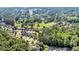 Aerial view of a neighborhood close to a golf course with lush trees and houses at 3071 Alice Ln., Little River, SC 29566