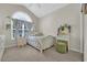 Bright bedroom features vaulted ceilings, a large window, and neutral decor at 3071 Alice Ln., Little River, SC 29566